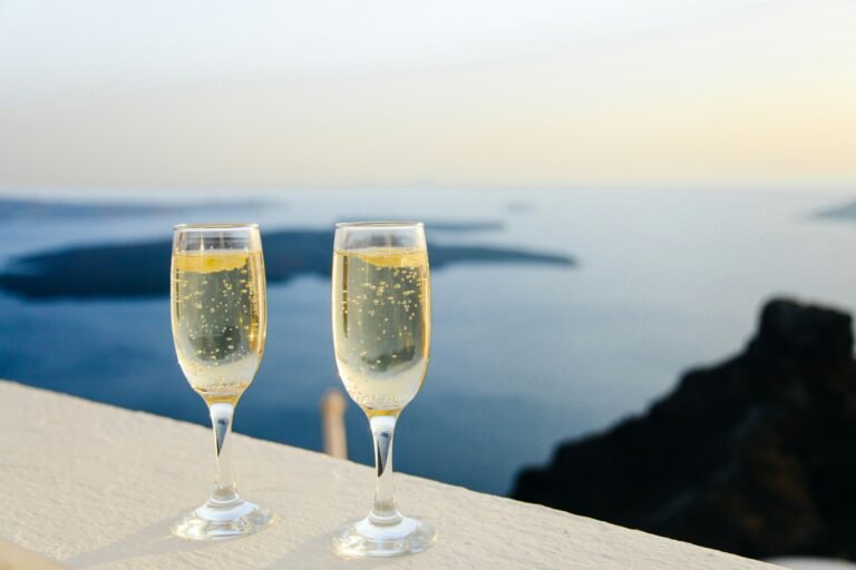 Two glasses of sparkling wine against a backdrop of the serene sea, capturing the essence of relaxation and celebration. Toast to seaside memories and the joy of coastal living. #SparklingWine #SeasideSips #CoastalCelebration