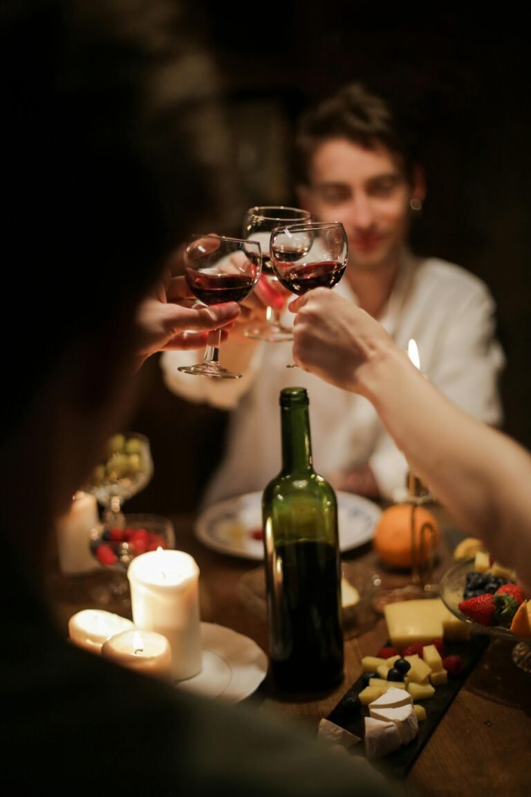 A heartwarming image capturing a group of friends or family raising their glasses of port wine in a toast during a delightful dinner, epitomizing cherished moments and camaraderie.