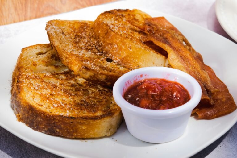 Indulge in golden brown French toast, a mouthwatering breakfast option to kickstart your day with delight.