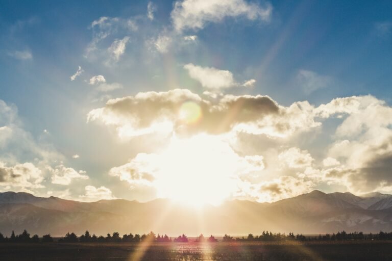 Spectacular sunset view of a winery nestled against the backdrop of the majestic Andes Mountains in Mendoza, Argentina.