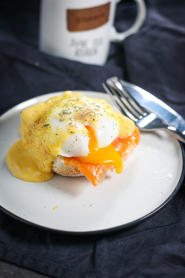 Savor the scrumptious egg benedict served on toast, a delightful breakfast option for starting your day right.