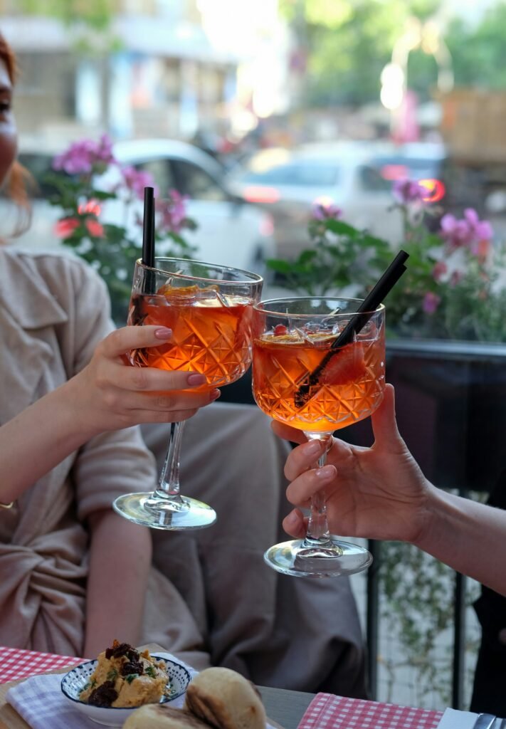 People toasting with Aperol Spritz