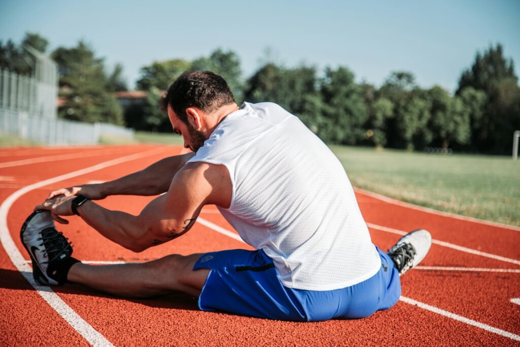 A person stretching before starting their morning run, preparing for an active day.