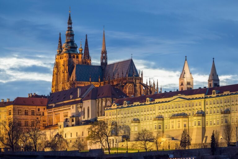 Prague Castle at Dusk with Illuminated Buildings in the Czech Republic
