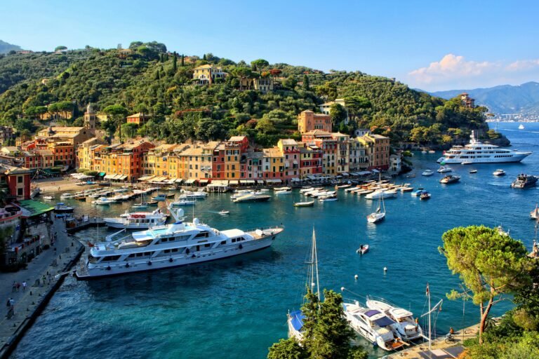 Summer postcard from the Italian Amalfi Coast featuring the sea, boats, and mountains