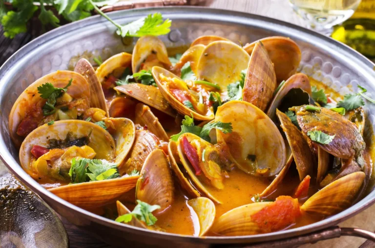 Traditional Portuguese seafood dish, Cataplana de Marisco, served in a copper pot.