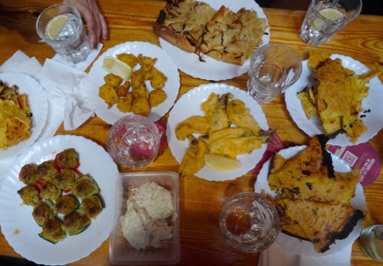 A table filled with a variety of traditional fried dishes and appetisers