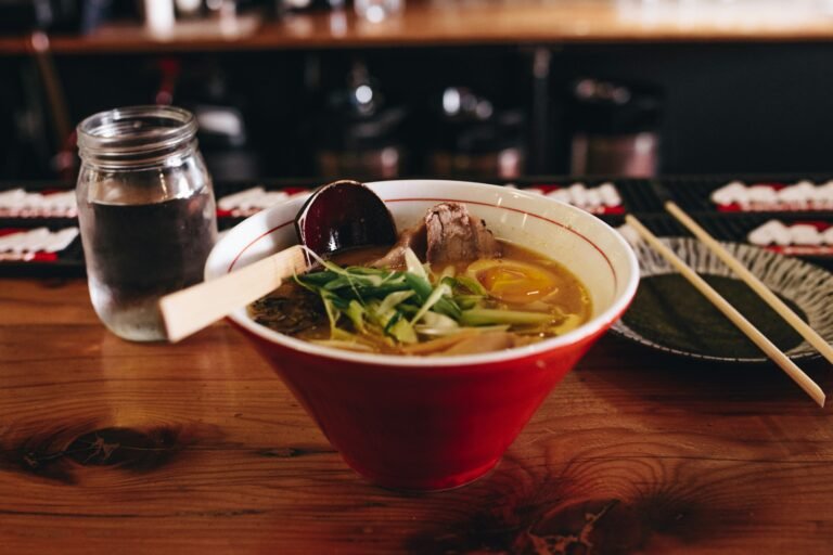 Bowl of ramen with sliced pork, egg, and green onions