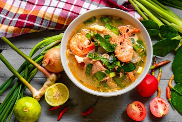 Thai tom yum soup with shrimp and fresh herbs