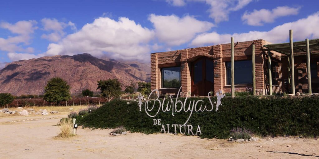 Burbujas de Altura winery in a high-altitude vineyard with scenic mountain views in Argentina.