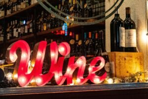 A cosy wine bar with wooden interiors, ambient lighting, and an inviting atmosphere.